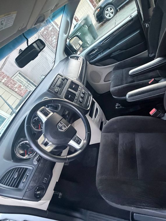 Front cabin of a minivan with dashboard and steering wheel